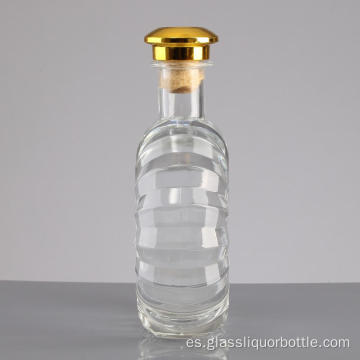 Botella de licor de cristal transparente